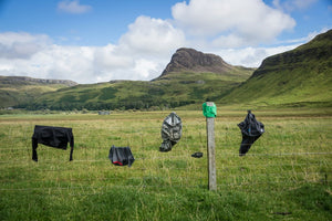 gear hung up on a fence in the countryside
