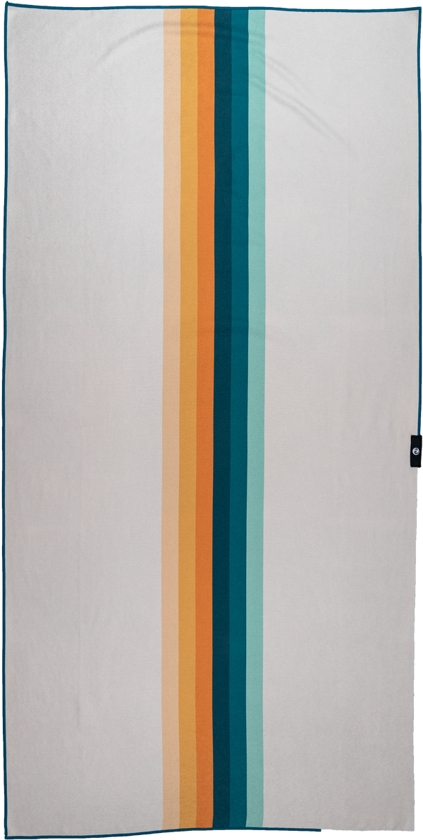 A towel with a minimalist design featuring a series of vertical stripes in varying colors running down the center. The stripes range from soft peach and bright orange to deep teal and light aqua, set against a neutral light gray background. The simple, modern design creates a bold yet understated look, emphasizing clean lines and a harmonious blend of warm and cool tones. The overall aesthetic is sleek and versatile, suitable for a variety of settings.