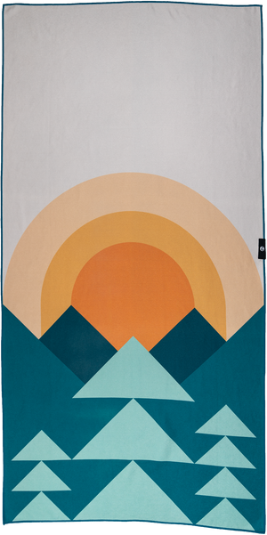 A towel featuring a minimalist geometric design of mountains and a sun. The lower half showcases a series of teal and light blue triangular shapes resembling mountains, while the upper half depicts a warm orange and yellow gradient sun rising or setting behind the peaks. The background is a light gray, providing contrast to the vibrant colors of the sun and mountains. The design is clean, modern, and inspired by nature, evoking a peaceful outdoor landscape.