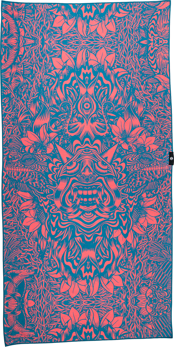 A towel with a bold and intricate design in coral and teal. The pattern features detailed, symmetrical illustrations of fantastical creatures, plants, and abstract elements, creating a dynamic and psychedelic visual effect. The central figure appears to be a grinning face with exaggerated features, surrounded by swirling lines, animal heads, and floral motifs. The coral outlines contrast sharply with the teal background, giving the towel a vibrant and energetic feel.