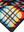 A close-up of a colorful geometric pattern featuring intersecting lines and bold shapes in vibrant reds, blues, yellows, and white. The design creates an eye-catching, plaid-like effect that adds depth and energy to the towel.
