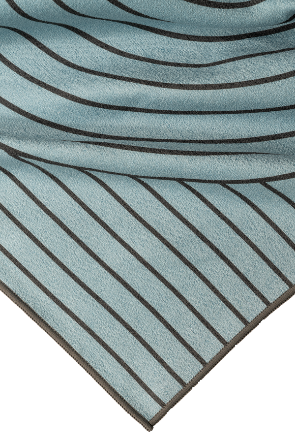 The towel "Life's Swell" corner shot reveals a smooth texture and sleek lines, designed for durability and comfort. Perfect for catching the ocean vibes and drying off in style!