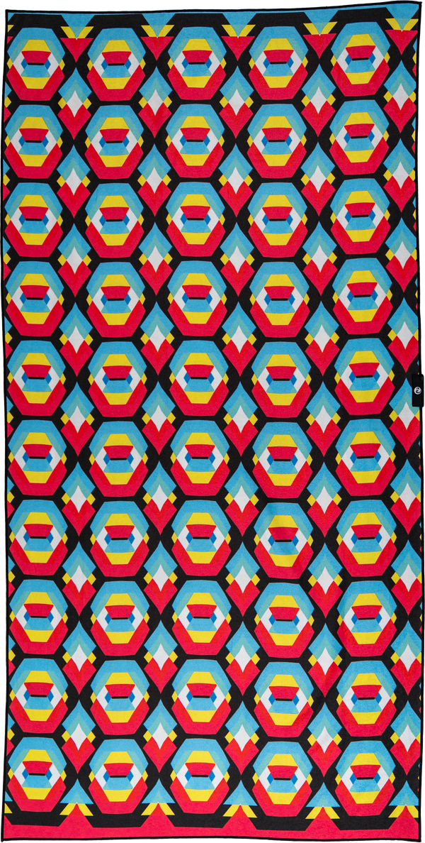 A colorful geometric towel featuring an eye-catching pattern of octagonal shapes in bright shades of blue, yellow, red, and black. The symmetrical design is bold and vibrant, perfect for standing out at the beach or pool.