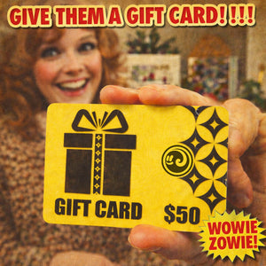 Person holding a yellow gift card from Happy Faced with decorative elements and text.