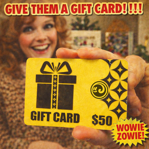 Person holding a yellow gift card from Happy Faced with decorative elements and text.