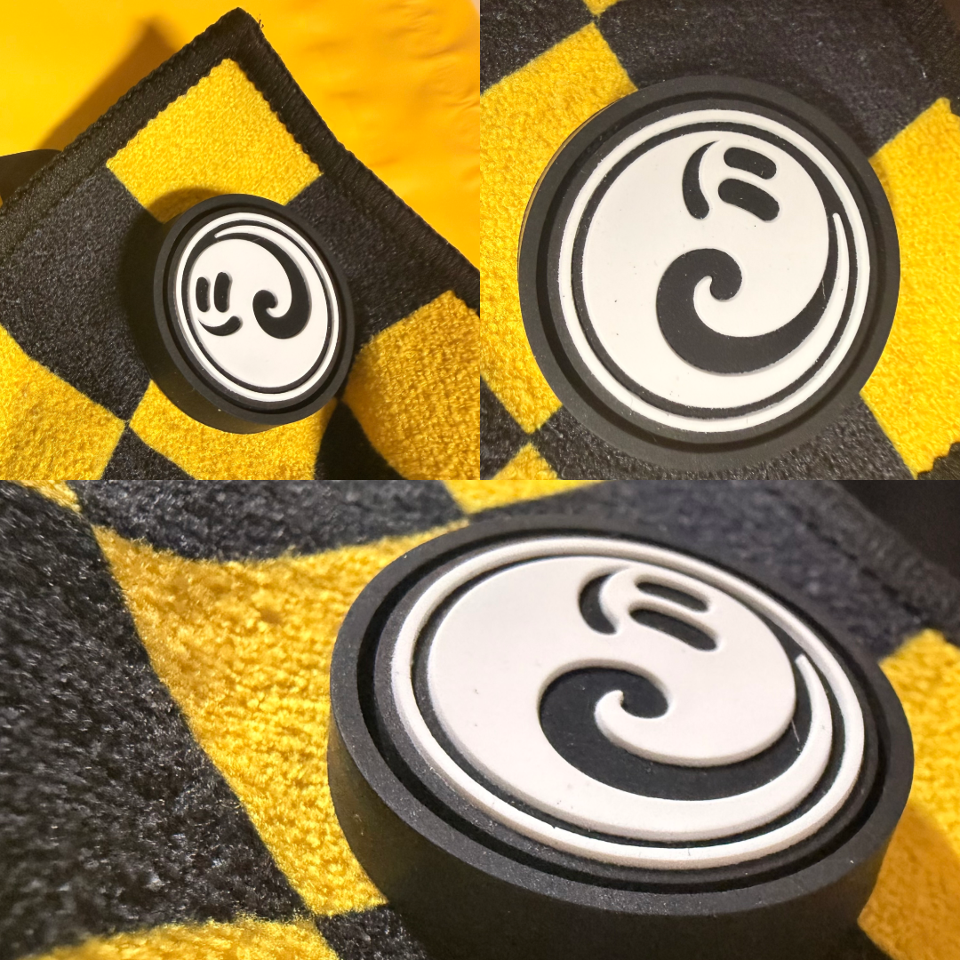 Close-up of the Happy Faced skate towel built-in magnet system