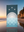 Towel with celestial design on a beach at sunset