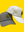 Two Happy Faced Rope caps, one gray and one white, on a yellow background. Great for Golf and Beach Days
