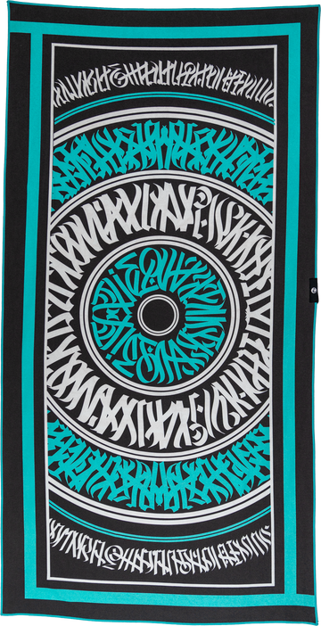A beach towel with a bold graphic design featuring the phrase 'What's Good' in a spiral layout, predominantly in black and turquoise colors. Calligrafiti by Mari Montenero