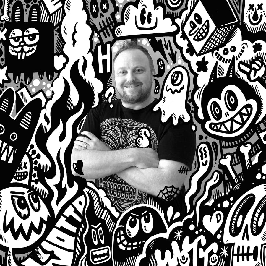 Artist Wotto surrounded by illustrated creatures